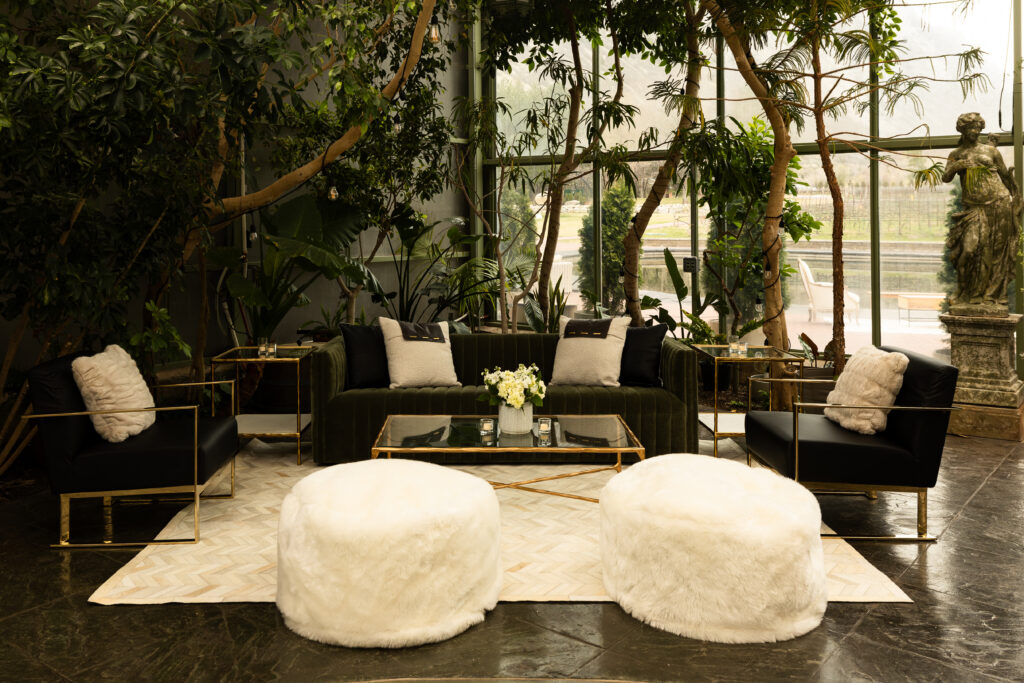 Vault Event Decor Furniture Vignette with modern aesthetic and curated decor pieces in a luxury greenhouse venue in Utah.